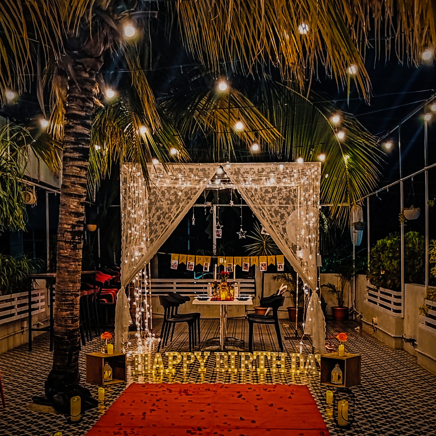 Exotic candle decorations and elegant cabana for a birthday celebration in Hyderabad with Miraculous Memories.